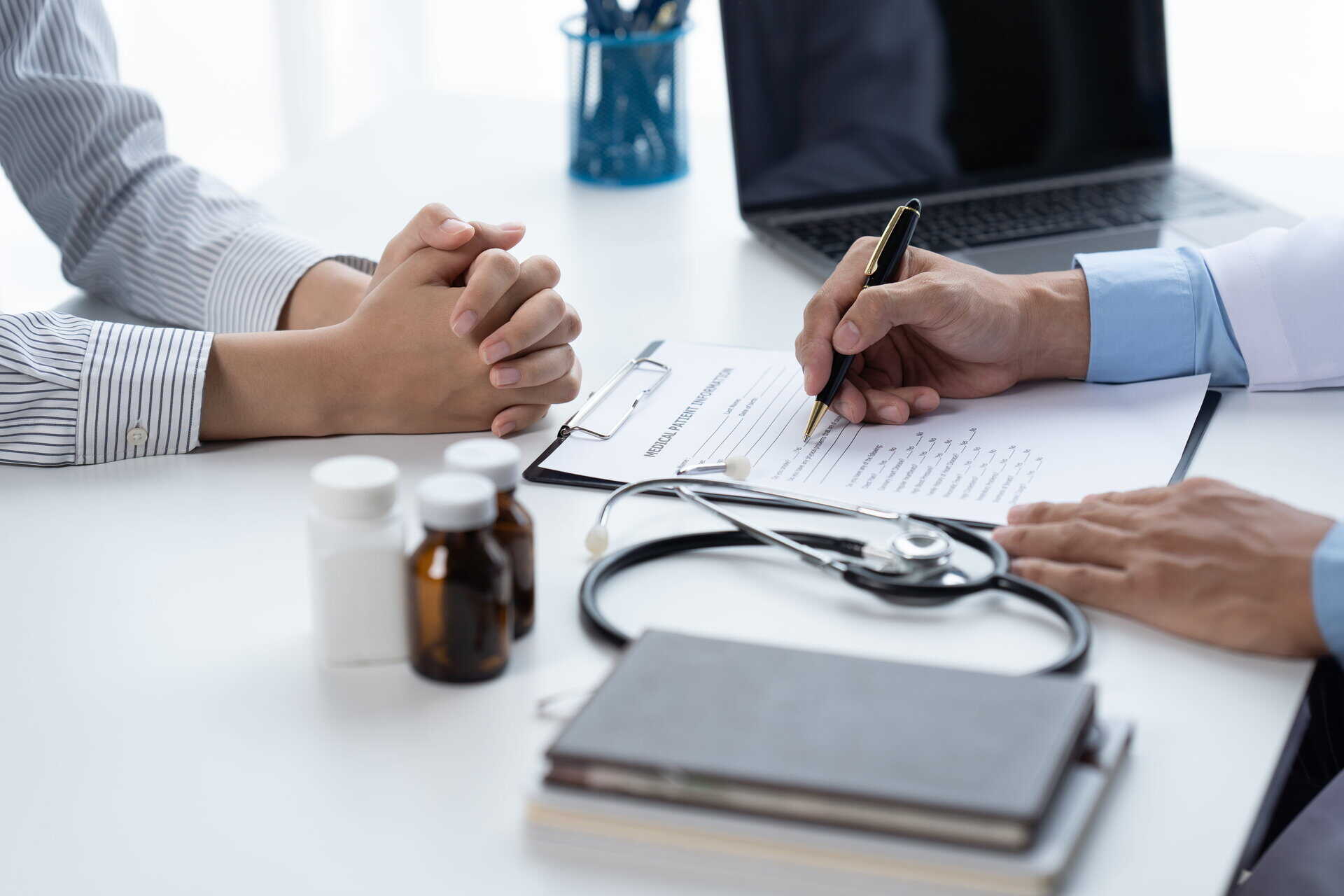 Guest consulting with a doctor about their annual health checkup results