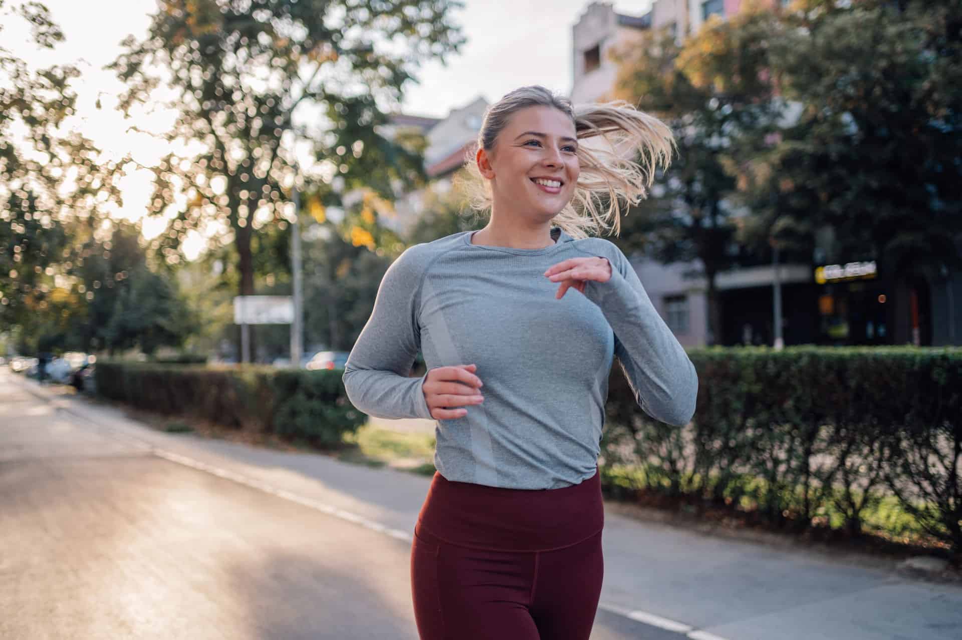 An energized woman going out for a run after getting NAD iv drip therapy